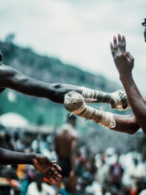 Men compete in a tribal martial arts event in Deidei, showcasing cultural traditions.